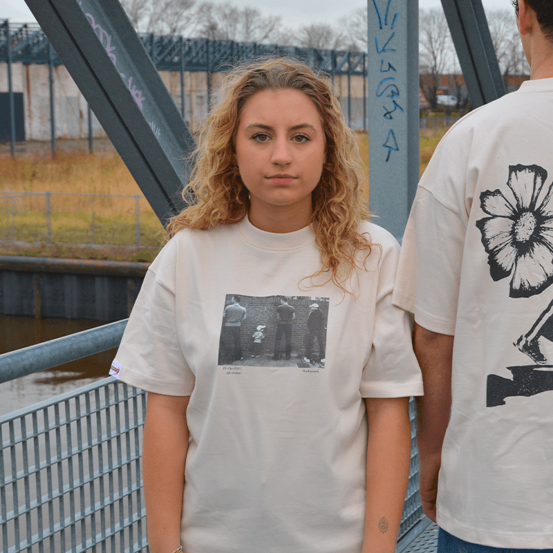 pissing kid tee off white on model Mudguard